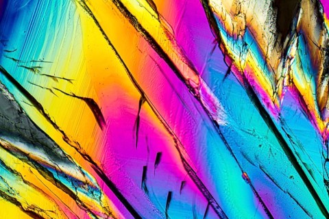 Colorful microscopic shot of Sucrose micro crystals in polarized light