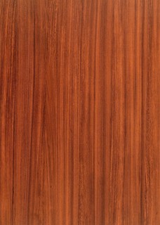 A full frame red brown wood grain surface