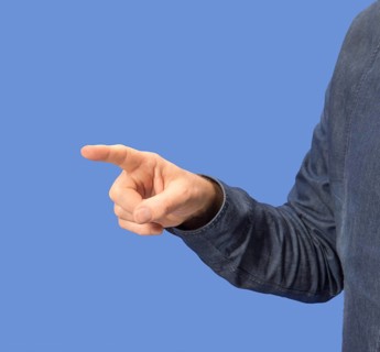 Pointing male hand in blue back