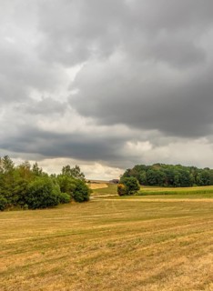 Stormy farmland scenery in Hohenlohe, an area in Southern Germany at late summer time