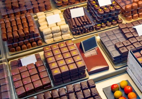 High angle shot showing lots of various artisan chocolate pralines