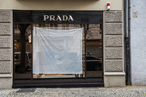 DEU Germany Germany Berlin A shop window of the luxury fashion company Prada is covered with a