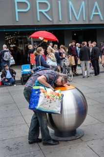 DEU Germany Germany Berlin A deposit bottle collector in front of the Primark store on