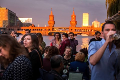 DEU Germany Germany Berlin Sunset on the terrace of the Fluxbau with the Oberbaum Bridge in the