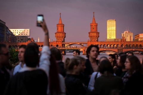 DEU Germany Germany Berlin Sunset on the terrace of the Fluxbau with the Oberbaum Bridge in the