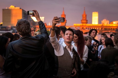 DEU Germany Germany Berlin Sunset on the terrace of the Fluxbau with the Oberbaum Bridge in the