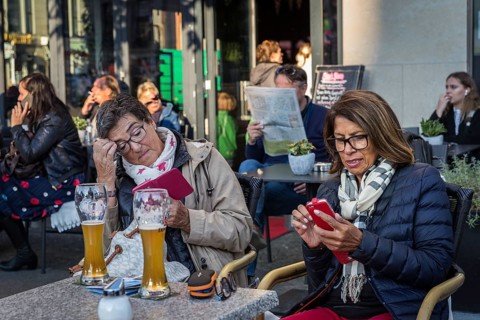 DEU Germany Germany Berlin Guests smoke, talk on the phone, read their mobile phones or look at the