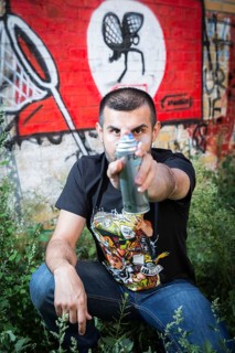 Germany Germany DEU Berlin Graffiti artist Ibo Omari in front of one of his works on a playground