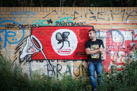 Germany Germany DEU Berlin Graffiti artist Ibo Omari in front of one of his works on a playground