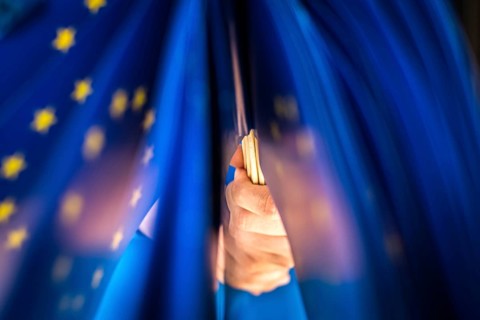 DEU Germany Germany Man with European flags in front of an info shop for Europe