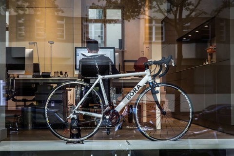 DEU Germany Germany Berlin Bicycle in an office window in Konstanzer Straße