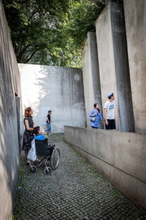 DEU Germany Germany Berlin Disabled tourist in a wheelchair explores Berlin with a city guide.