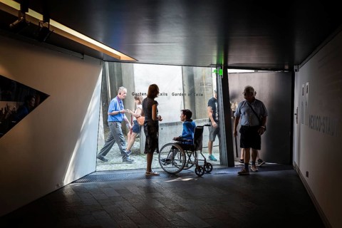DEU Germany Germany Berlin Disabled tourist in a wheelchair explores Berlin with a city guide.
