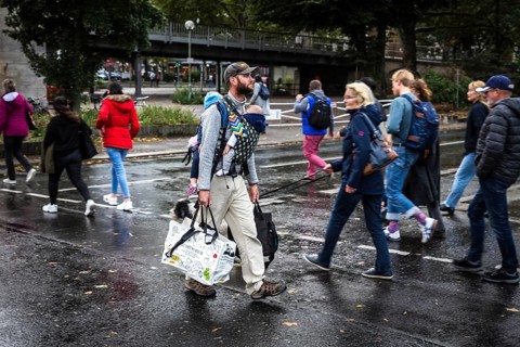 DEU Germany Germany Berlin A father with his two children on his stomach and back walks with