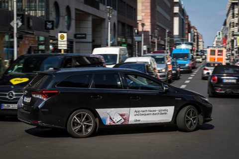 DEU Germany Germany Berlin An Uber taxi on Friedrichsstrasse