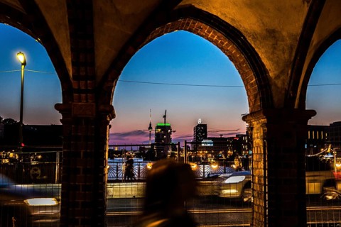 DEU Germany Germany Berlin Evening atmosphere seen through an arch of the Oberbaum Bridge