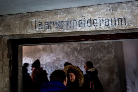 POL Poland Auschwitz Scenes at the Holocaust Memorial .Visitor entering the room for haircuts in