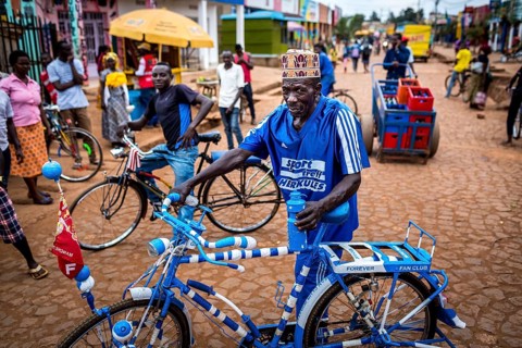 RWA RWANDA Rwanda Kayonza A cyclist with a decorated bicycle poses for a photo