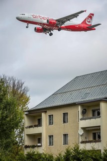 DEU Germany Germany Berlin Landing approach of an Air Berlin aircraft over residential buildings at