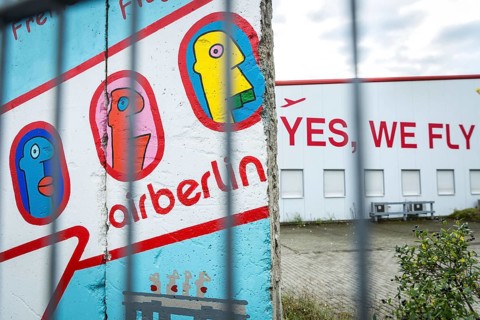 DEU Germany Germany Berlin A closed Air Berlin hangar with graffiti by Thierry Noir on pieces of