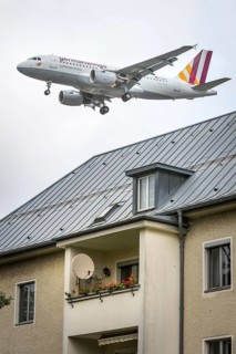 DEU Germany Germany Berlin Landing approach of a German Wings aircraft over residential buildings