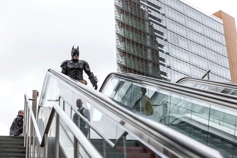 DEU Germany Germany Berlin A man wearing a Batman costume walks across Potsdamer Platz
