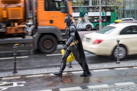 DEU Germany Germany Berlin A man wearing a Batman costume walks across Potsdamer Platz