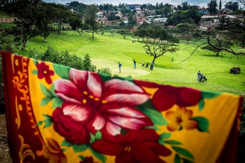 RWA RWANDA RUANDA Kigali Rwandans play on a centrally located golf course at lunchtime. The ceiling
