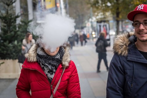 DEU Germany Germany Berlin A couple with an e-cigarette blowing out vapour