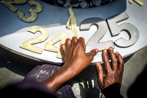 RWA RWANDA RUANDA Kigali An assistant completing the flame in preparation for the genocide