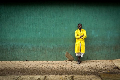 RWA RWANDA RUANDA Kigali A worker pauses against a wall in the Kiyovu banking district