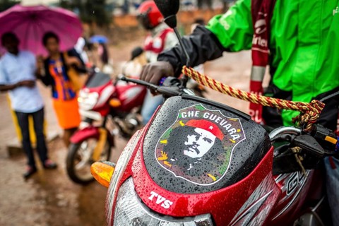 RWA RWANDA RUANDA Kigali motorbike taxi driver with Che Guevara sticker
