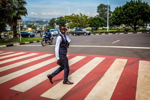 RWA RWANDA RUANDA Kigali A pedestrian in a suit crosses a zebra crossing in the banking district of