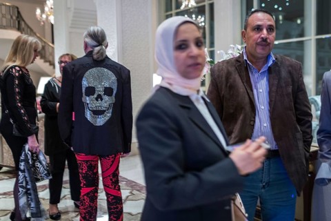 Egypt Hurghada Guests wait in a hotel lobby for the start of an event. One guest is wearing a