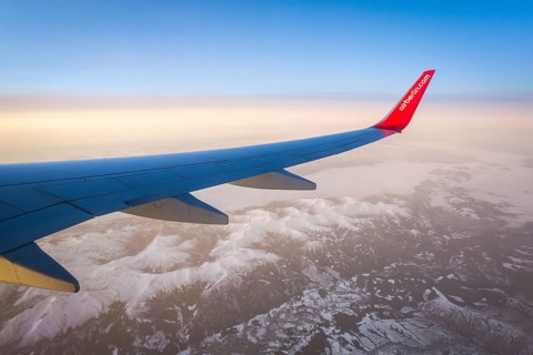 Egypt Hurghada aeroplane with Air Berlin lettering over snowy mountains