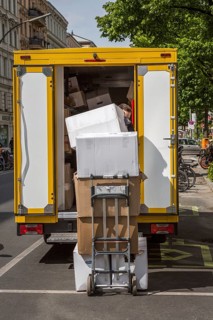 DEU Germany Germany Berlin A courier delivers parcels on Bergmannstrasse