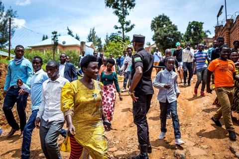 RWA RWANDA RUANDA Kigali residents, who had been waiting for the arrival of celebrities, walk
