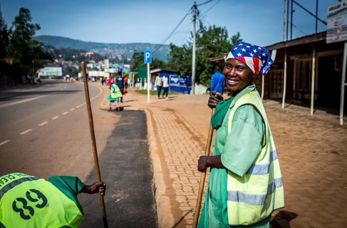 RWA RWANDA RUANDA Kigali Street cleaners clean a road leading to the Genocide Memorial on the