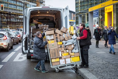 DEU Germany Germany Berlin Courier drivers load parcels and packages in front of a post office near