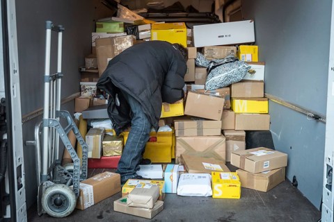 DEU Germany Germany Berlin Courier drivers load parcels and packages in front of a post office near