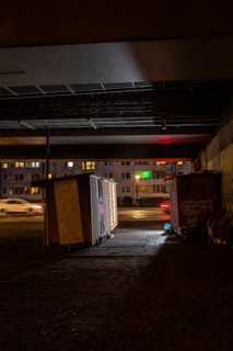 DEU Germany Germany Berlin Wooden shacks financed by donations stand under the motorway bridge in
