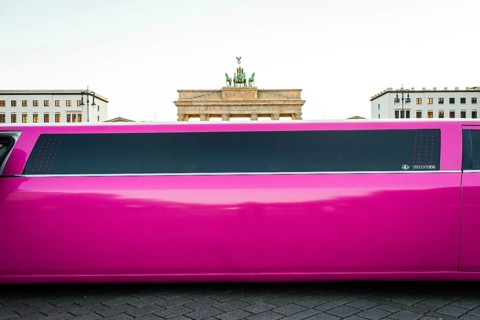 DEU Germany Germany Berlin Pink stretch limousine in front of the Brandenburg Tor