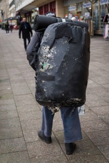 DEU Germany Germany Berlin A homeless man carries a huge bag with his belongings through the city