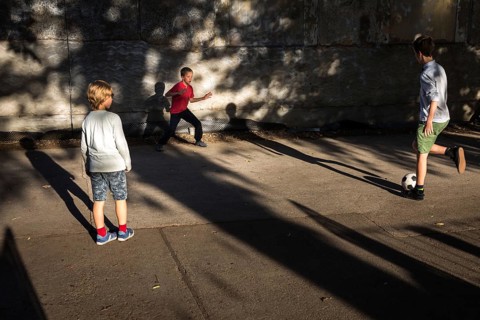 DEU Germany Germany Berlin Children play football while their parents watch a World Cup match in