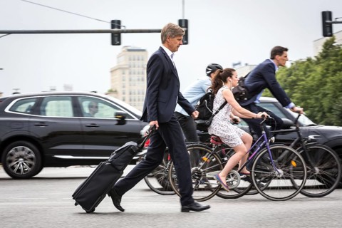DEU Germany Germany Berlin Scene with cyclists in traffic in the capital Karl-Marx-Alle, corner of