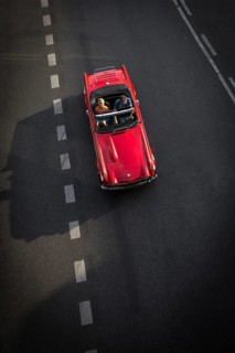 DEU Germany Germany Berlin Scene with convertible driver on Schlossstraße in Steglitz
