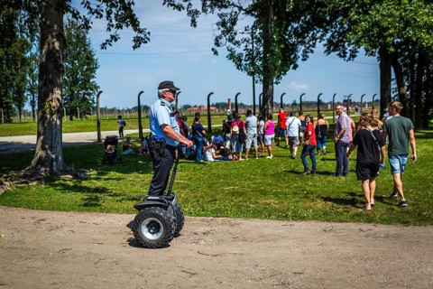 POL Poland Poland Auschwitz-Birkenau Guard on Segway in the Auschwitz-Birkenau camp