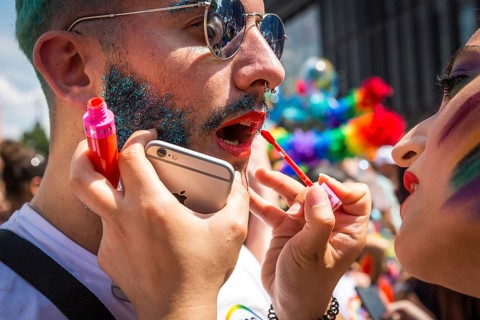 DEU Germany Germany Berlin Scenes of the Christopher Street Day CSD on a hot Saturday . Woman makes