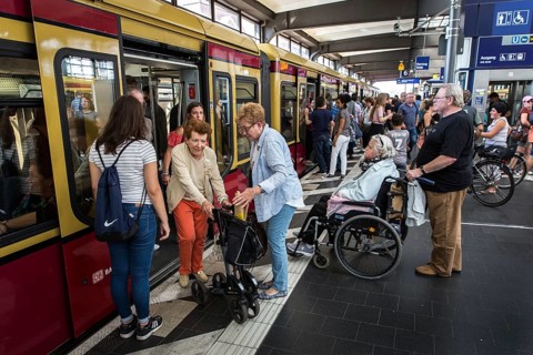 DEU Germany Germany Berlin A woman with a walker leaves the S-Bahn at Zoo station