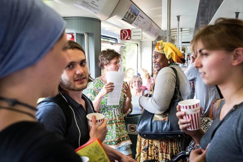 DEU Germany Germany Berlin Students discuss the G20 summit on the Berlin S-Bahn. A loose group of